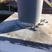 Chimney with deteriorated sealant.